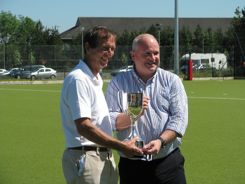 Stephen Stowell, England Grand Masters Captain, receiving the Linburn Trophy from Scottish Hockey Hon President Martin Boag